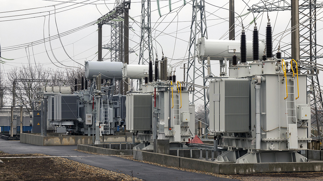 Oil-immersed power transformer installed within an industrial distribution system